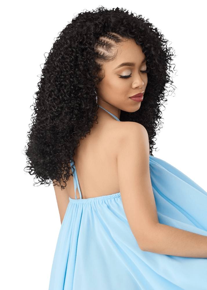 A woman with long, voluminous, tightly curled black hair half with braids in Jayda wayda style
